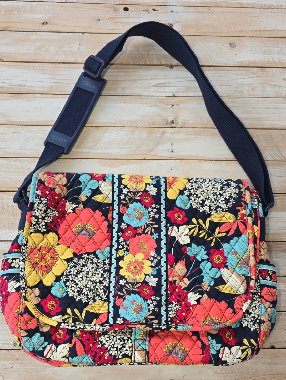 Vera Bradley messenger bag in the Retired "Happy Snails" floral pattern.